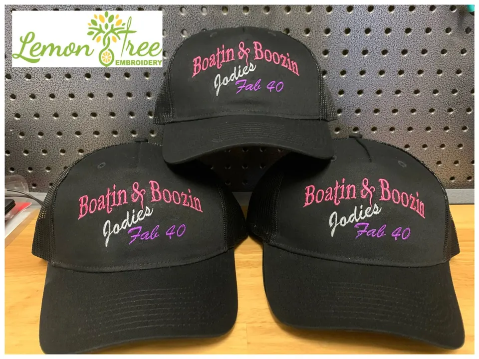 Three black hats embroidered with Boatin and Boozin Jodies Fab 40 in pink and purple