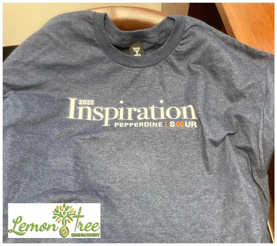 Gray tee printed with 2022 Inspiration Pepperdine in white and orange